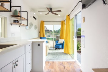 Open living area with sliders to let in a breeze
