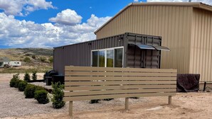 A modern building with a large garage and a smaller attached structure.