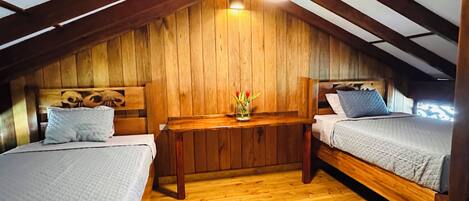 Premium bedding, blackout drapes, iron/ironing board, travel crib