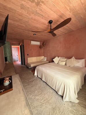 Deluxe Triple Room, 1 Bedroom, Partial Ocean View | Minibar, in-room safe, free WiFi, bed sheets - Casa Malagua Hotel Boutique (Santa Maria Colotepec)