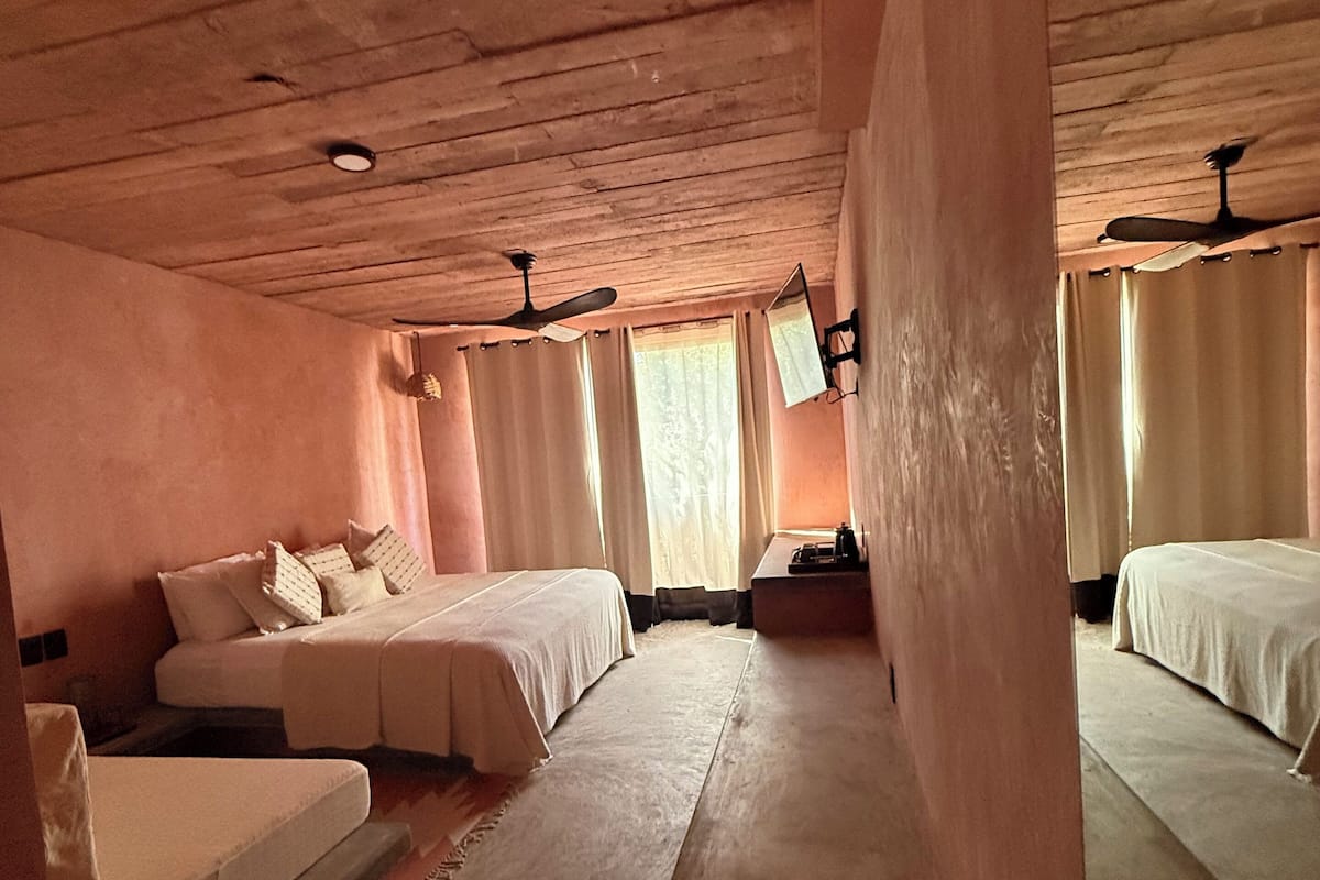 Deluxe Triple Room, 1 Bedroom, Partial Ocean View | Minibar, in-room safe, free WiFi, bed sheets