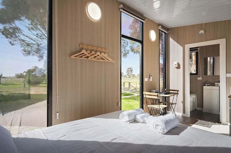 1 bedroom, bed sheets. Tiny Tranquility by Tiny Away