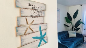 A wall with a decorative piece stating "This is my Happy PLACE" and a starfish. - Close to Best Gulf Beaches, Downtown Venice & Wellen Park - Long Term Available (Venice)