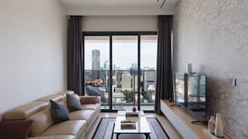 Family Suite, 3 Bedrooms, Club lounge access, City View | Living area | 65-inch Smart TV with cable channels, Netflix, smart speakers
