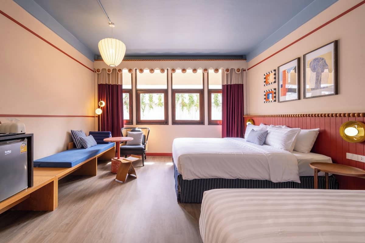 Deluxe Triple Room, Private Bathroom | Free minibar, desk, laptop workspace, soundproofing