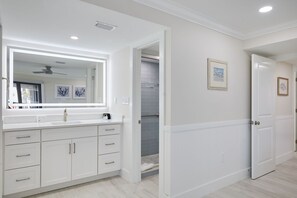 Shower, hair dryer, towels, shampoo