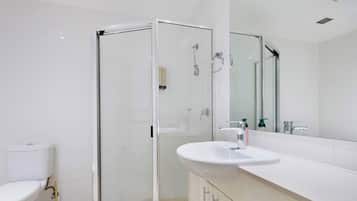 Shower, hair dryer, towels, shampoo
