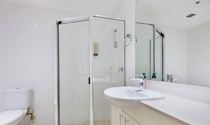 Shower, hair dryer, towels, shampoo