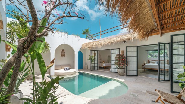 A poolside area with a thatched roof, a lounge chair, and a bed with a view. - Villa Dusa  (Canggu)