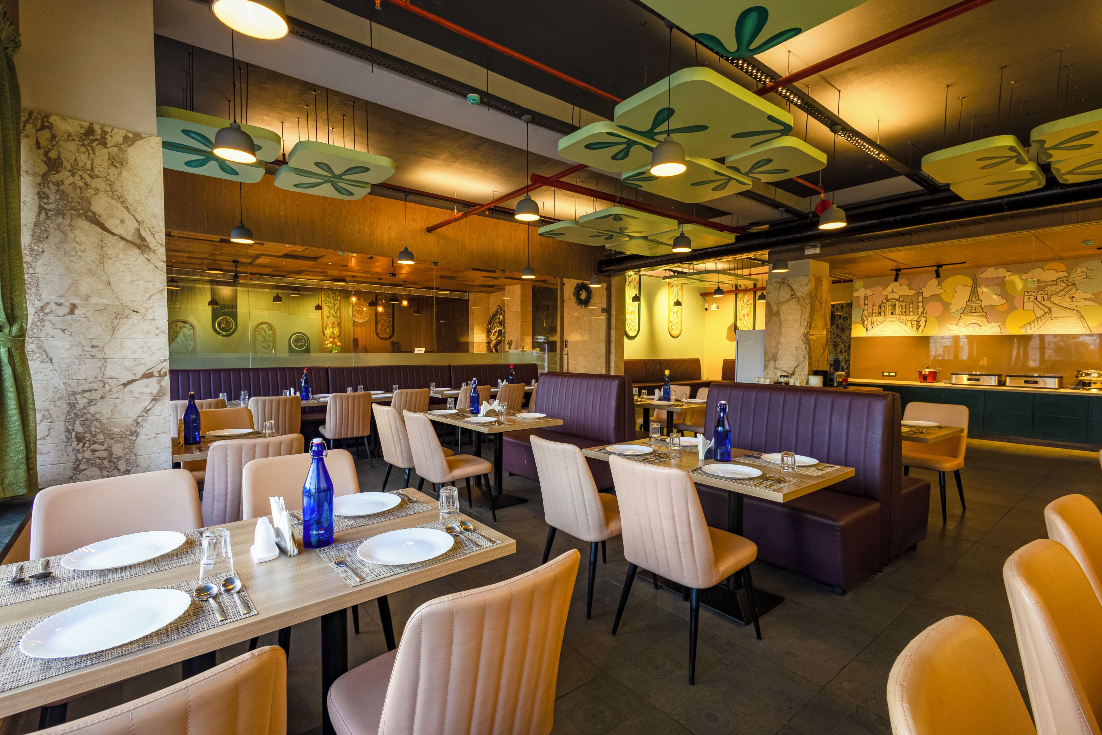 A restaurant interior with booths, tables, and a bar area.