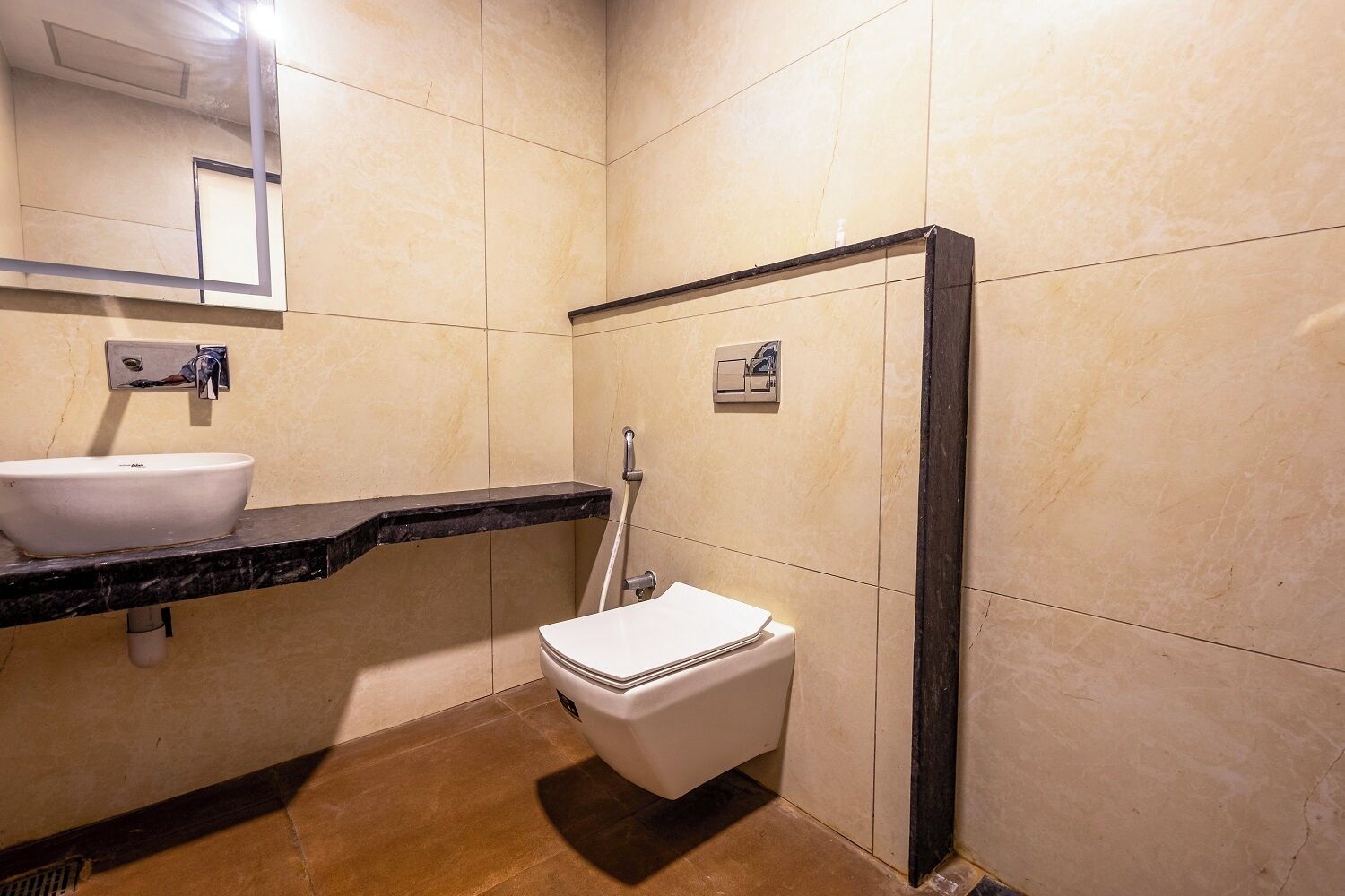 A bathroom with a white sink, a toilet, and a shower.