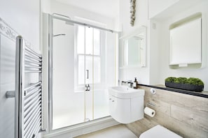Shower, hair dryer, towels, soap