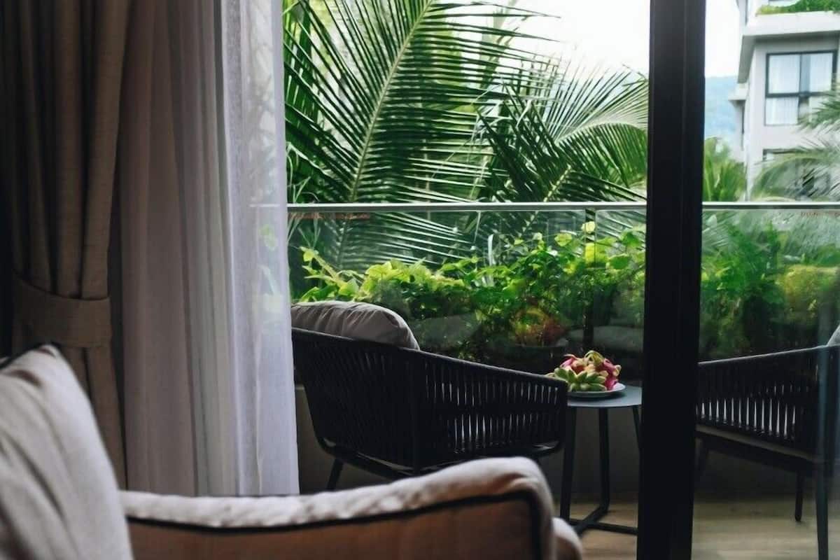 Suite Deluxe, balcón, vista a la alberca | Terraza o patio