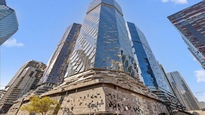 A tall, modern skyscraper with a unique, angular design.
