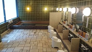 A public restroom with multiple toilets, a sink area with hand soap, and a mirror. - Daiyamonndo kyoto sosaethi  (Kyoto)