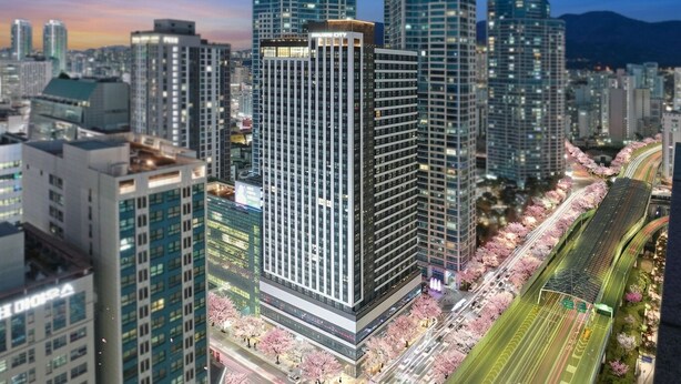 A high-rise building with a modern design, surrounded by other tall buildings, and a well-lit street with trees. - SOTA SUITE Busan Seomyeon (Busan)