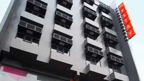 A multi-story building with a cafe and a hotel named 'mySTAY Hotel'. - mySTAY BGC West (Makati)
