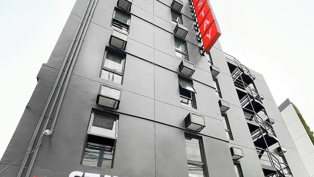 A multi-story hotel with a prominent red sign reading "mySTAY Hotel BGCNorth". - mySTAY BGC North (Makati)