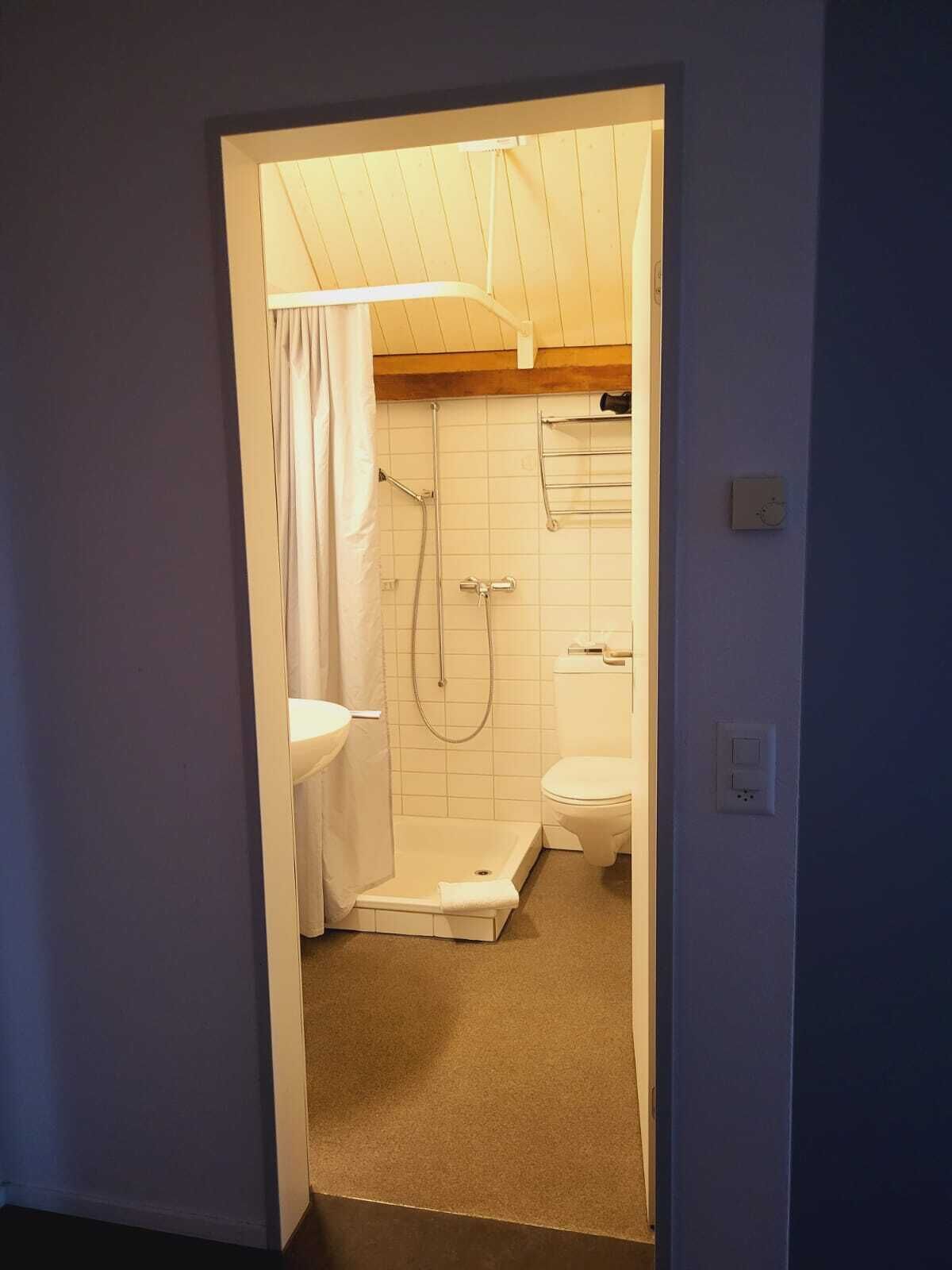 Comfort Studio | Bathroom | Hair dryer, towels, soap, shampoo