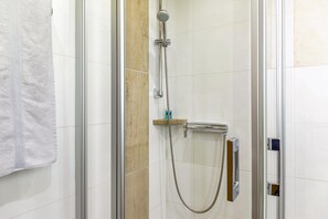 A shower with a handheld showerhead, a handheld shower attachment, and a towel rack. - Studio 'Burgberg' with Mountain View, Balcony and Wi-Fi (Mittenwald)