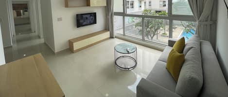 Standard Apartment, 3 Bedrooms, Pool View | Living area | 20-inch flat-screen TV with digital channels