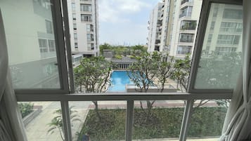 Standard Apartment, 3 Bedrooms, Pool View | Living area | 20-inch flat-screen TV with digital channels