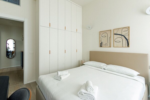 1 bedroom, desk, iron/ironing board, travel crib