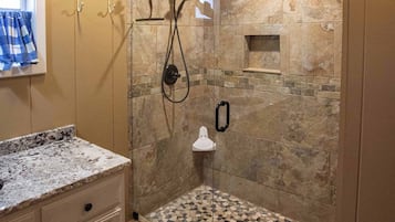 Shower, hair dryer, towels, toilet paper