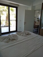 Apartment, 1 Bedroom, Partial Sea View | Blackout drapes, iron/ironing board, free WiFi