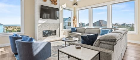 Televisión, chimenea, reproductor de DVD, videoteca