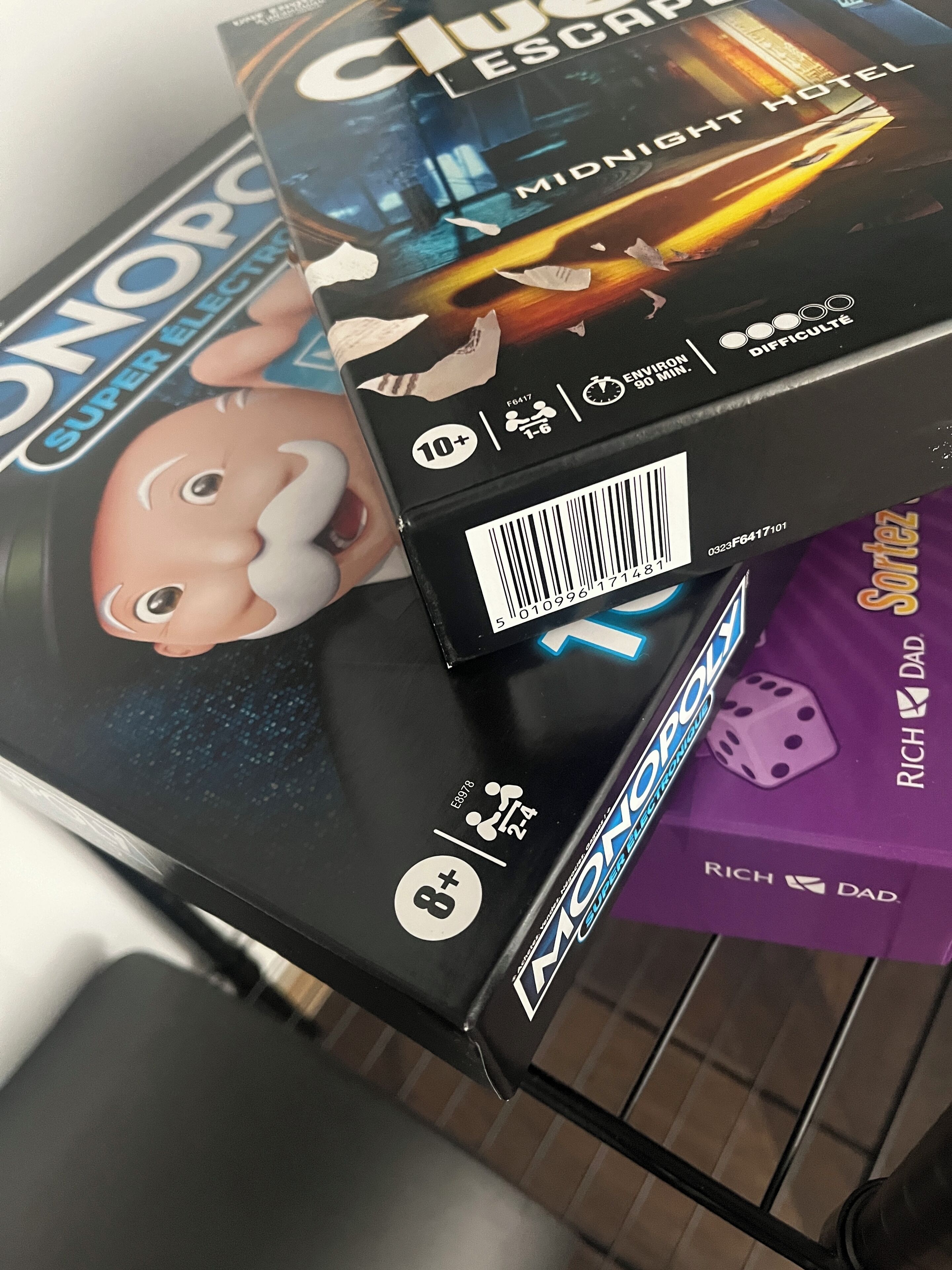 A box of Monopoly with a 'Rich Dad' theme, indicating a focus on financial education.