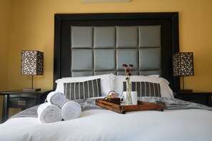 Deluxe Suite, Patio, Garden View | Iron/ironing board, free WiFi