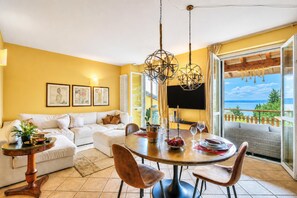 Standard Apartment, 1 Bedroom, Balcony, Mountainside (Alice Suite Terrace, lake view & Park) | Living area | Flat-screen TV - Alice Suite Terrace, Lake View & Park (Gardone Riviera)
