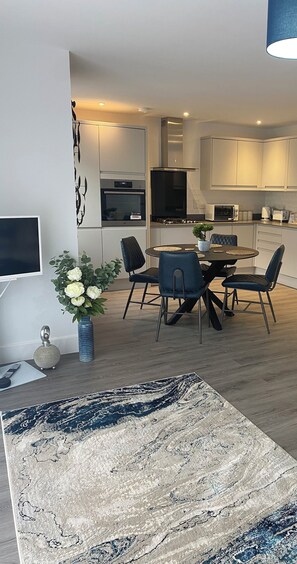 Enjoy meals in the kitchen with an oven and microwave, and dine at the round table with four chairs.