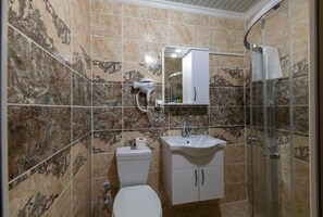 Shower, free toiletries, hair dryer, slippers