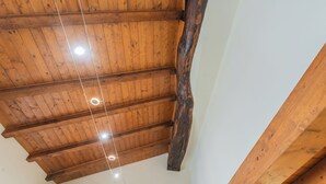 A wooden ceiling with exposed beams and recessed lighting. - Domus 3 in Como by Rent All Como (Como)