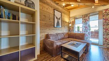 Comfort Apartment, 2 Bedrooms, Balcony, Mountain View | Living area | 50-inch flat-screen TV with cable channels