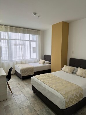 Deluxe Double Room, Courtyard View | In-room safe, desk, laptop workspace, iron/ironing board