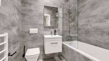 Shower, eco-friendly toiletries, hair dryer, towels