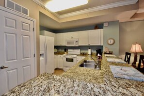 Fridge, microwave, oven, stovetop - Amazing Sunset Oceanfront Condo (Panama City Beach)