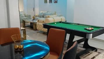 Luxury Apartment, Pool View | Living area | 52-inch Smart TV with satellite channels, video game console, Netflix