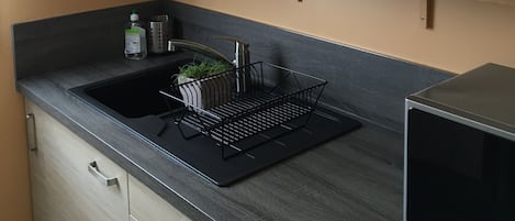 Fridge, microwave, stovetop, coffee/tea maker