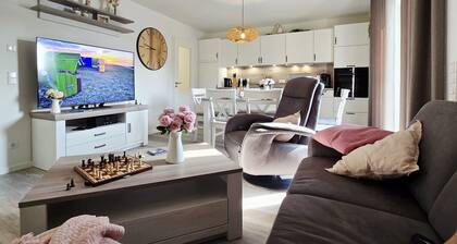 StrandGut 49 – Penthouse mit Weitblick. Sauna. Dachterrasse. Exklusiv.