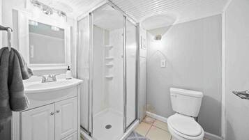 Shower, hair dryer, towels, toilet paper