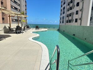 Outdoor pool, open 7:00 AM to 10:00 PM, pool umbrellas, sun loungers - Urban Home Stay (Recife)