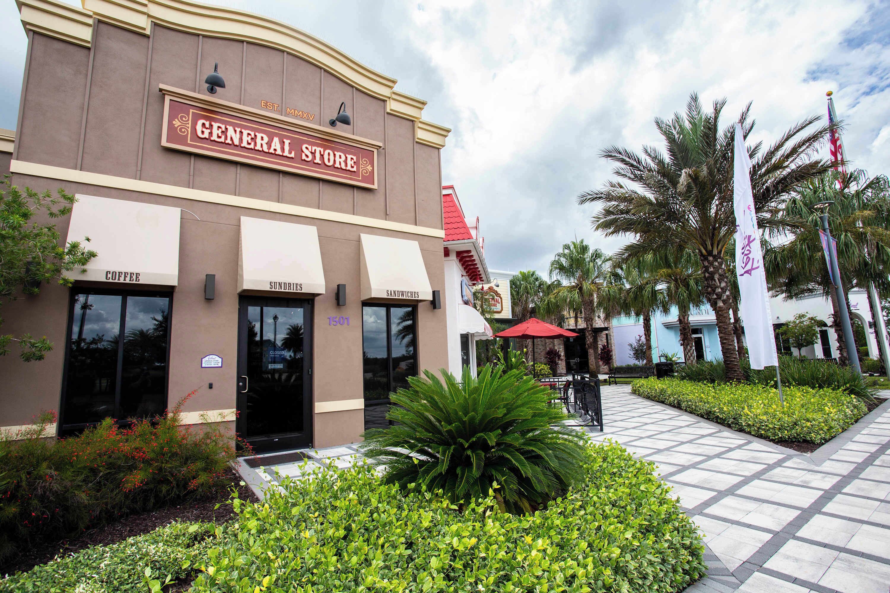 A building with a sign reading "GENERAL STORE" and two entrances labeled "COFFEE" and "SUNDRIES".