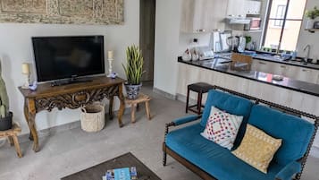 Standard Apartment | Living area | 60-inch Smart TV with digital channels, Netflix, streaming services