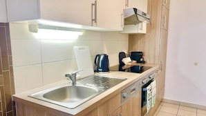 Coffee/tea maker, fridge, microwave, oven