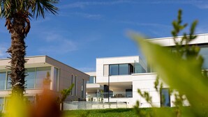 A modern building with large windows and a flat roof.
