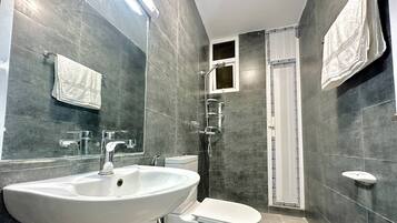 Shower, towels, soap, toilet paper
